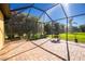 Screened patio with grill and garden planter at 109 Bonita Dr, Rotonda West, FL 33947