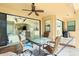 Covered patio with seating area and view into the home at 109 Bonita Dr, Rotonda West, FL 33947
