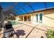 Screened patio with grill and pool view at 109 Bonita Dr, Rotonda West, FL 33947