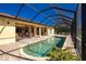 Screened pool and patio area with backyard view at 109 Bonita Dr, Rotonda West, FL 33947