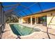 Screened pool and patio area with backyard view at 109 Bonita Dr, Rotonda West, FL 33947