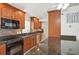 Kitchen boasts granite counters, wood cabinets, and a breakfast bar at 1113 Brown St, Englewood, FL 34224