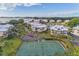 Aerial view of community featuring tennis courts and waterfront homes at 13104 Via Cassia, Placida, FL 33946