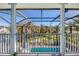 Balcony overlooking the pool and lush landscaping at 13104 Via Cassia, Placida, FL 33946