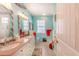 Double vanity bathroom with light cabinetry and granite countertops at 13104 Via Cassia, Placida, FL 33946