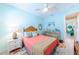 Light and bright bedroom with coral bedding and coastal decor at 13104 Via Cassia, Placida, FL 33946