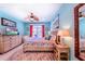 Coastal-themed bedroom with king-size bed and private balcony access at 13104 Via Cassia, Placida, FL 33946