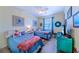 Bedroom featuring twin beds, light blue bedding, and teal dresser at 13104 Via Cassia, Placida, FL 33946