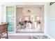 View of living room through sliding glass doors leading to patio at 13104 Via Cassia, Placida, FL 33946
