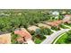Aerial view of community with lush landscaping and lake at 13123 Preserve Ct, Port Charlotte, FL 33953
