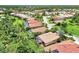 Aerial view of houses in a neighborhood near a lake at 13123 Preserve Ct, Port Charlotte, FL 33953
