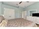 Bright bedroom with double doors and a dresser at 13123 Preserve Ct, Port Charlotte, FL 33953