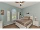 Guest bedroom with a neutral color scheme and plantation shutters at 13123 Preserve Ct, Port Charlotte, FL 33953