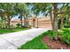 One-story house with a tile roof, driveway, and green lawn at 13123 Preserve Ct, Port Charlotte, FL 33953