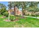 One story house with tan exterior, landscaping, and palm trees at 13123 Preserve Ct, Port Charlotte, FL 33953