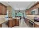 Eat-in kitchen with granite counters and access to backyard patio at 13123 Preserve Ct, Port Charlotte, FL 33953