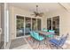 Outdoor patio with seating area and ceiling fan at 13123 Preserve Ct, Port Charlotte, FL 33953