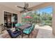Spacious screened patio with dining set and lounge chairs at 13123 Preserve Ct, Port Charlotte, FL 33953