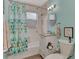 Clean bathroom with a tub, shower, and updated vanity at 138 Winson Ave, Englewood, FL 34223