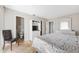 Main bedroom with floral bedding and en-suite bathroom access at 1531 Placida Rd # 1-204, Englewood, FL 34223