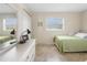 Bedroom with twin bed, dresser, and window with blinds at 1531 Placida Rd # 1-204, Englewood, FL 34223