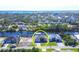 Aerial view of a waterfront home with a large yard and a canal at 15336 Lakeland Cir, Port Charlotte, FL 33981