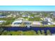 Wide aerial view of canal front homes at 15336 Lakeland Cir, Port Charlotte, FL 33981