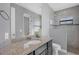 Bathroom with granite countertop and walk-in shower at 15336 Lakeland Cir, Port Charlotte, FL 33981