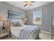 Bright bedroom with a queen-size bed and large window at 15336 Lakeland Cir, Port Charlotte, FL 33981