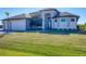 Stunning two-story home with a three-car garage and lush landscaping at 15336 Lakeland Cir, Port Charlotte, FL 33981