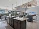 Open concept kitchen with island, stainless steel appliances, and views of the living area at 15336 Lakeland Cir, Port Charlotte, FL 33981