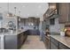 Modern kitchen with granite countertops and stainless steel appliances at 15336 Lakeland Cir, Port Charlotte, FL 33981