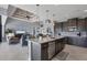 Open concept kitchen with island, granite countertops, and stainless steel appliances at 15336 Lakeland Cir, Port Charlotte, FL 33981