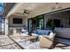 Outdoor lanai with seating area and TV at 15336 Lakeland Cir, Port Charlotte, FL 33981