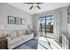 Living room with comfy sofa and sliding doors to lanai at 15336 Lakeland Cir, Port Charlotte, FL 33981