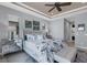 Main bedroom with king-size bed and ensuite bathroom at 15336 Lakeland Cir, Port Charlotte, FL 33981