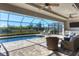 Relaxing pool and lanai area with seating and outdoor kitchen at 15336 Lakeland Cir, Port Charlotte, FL 33981