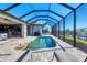 Enclosed pool and lanai with canal views at 15336 Lakeland Cir, Port Charlotte, FL 33981