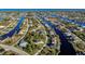 Aerial view of waterfront community with canals and houses at 15375 Taurus Cir, Port Charlotte, FL 33981