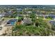 An aerial view of the property showcases its large lot, screened lanai, and proximity to waterfront canals at 15375 Taurus Cir, Port Charlotte, FL 33981