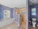 Bathroom with shower, toilet, and large garden tub at 15375 Taurus Cir, Port Charlotte, FL 33981