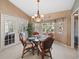 Charming breakfast nook with glass table and view of backyard at 15375 Taurus Cir, Port Charlotte, FL 33981