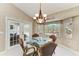 Inviting dining area with seating for four, overlooking the backyard and pool at 15375 Taurus Cir, Port Charlotte, FL 33981