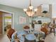 Kitchen features a breakfast nook with glass table and wicker chairs at 15375 Taurus Cir, Port Charlotte, FL 33981