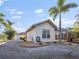 Single story home with screened patio and landscaping at 15375 Taurus Cir, Port Charlotte, FL 33981