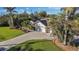 Single-story home with landscaped yard and two-car garage at 15375 Taurus Cir, Port Charlotte, FL 33981