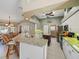 Large kitchen with granite countertops, white cabinets, and an island at 15375 Taurus Cir, Port Charlotte, FL 33981