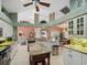 Spacious kitchen with granite island, white cabinets, and open floor plan at 15375 Taurus Cir, Port Charlotte, FL 33981