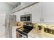 Well-equipped kitchen with stainless steel appliances and stylish countertops at 15375 Taurus Cir, Port Charlotte, FL 33981