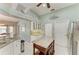 Spacious kitchen with island, white cabinets, and tiled flooring at 15375 Taurus Cir, Port Charlotte, FL 33981